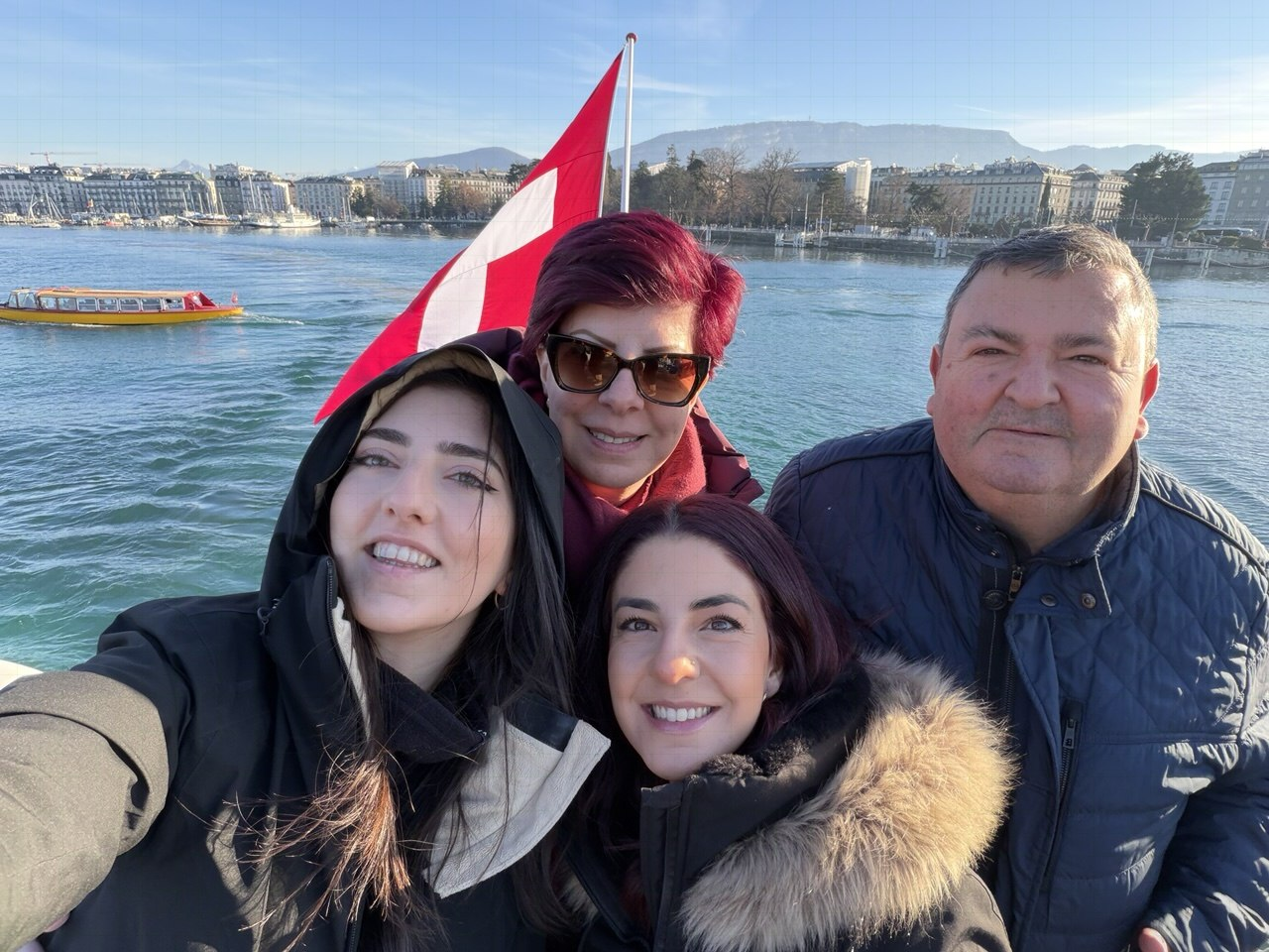 The Sandrouni family smiling together on a day away from the workshop
